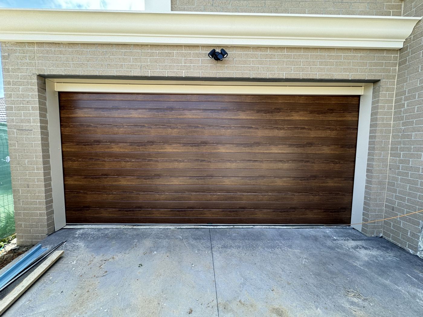 Timber look panel lift garage door